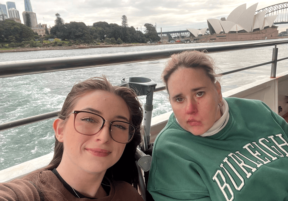 NDIS client with support worker at gym